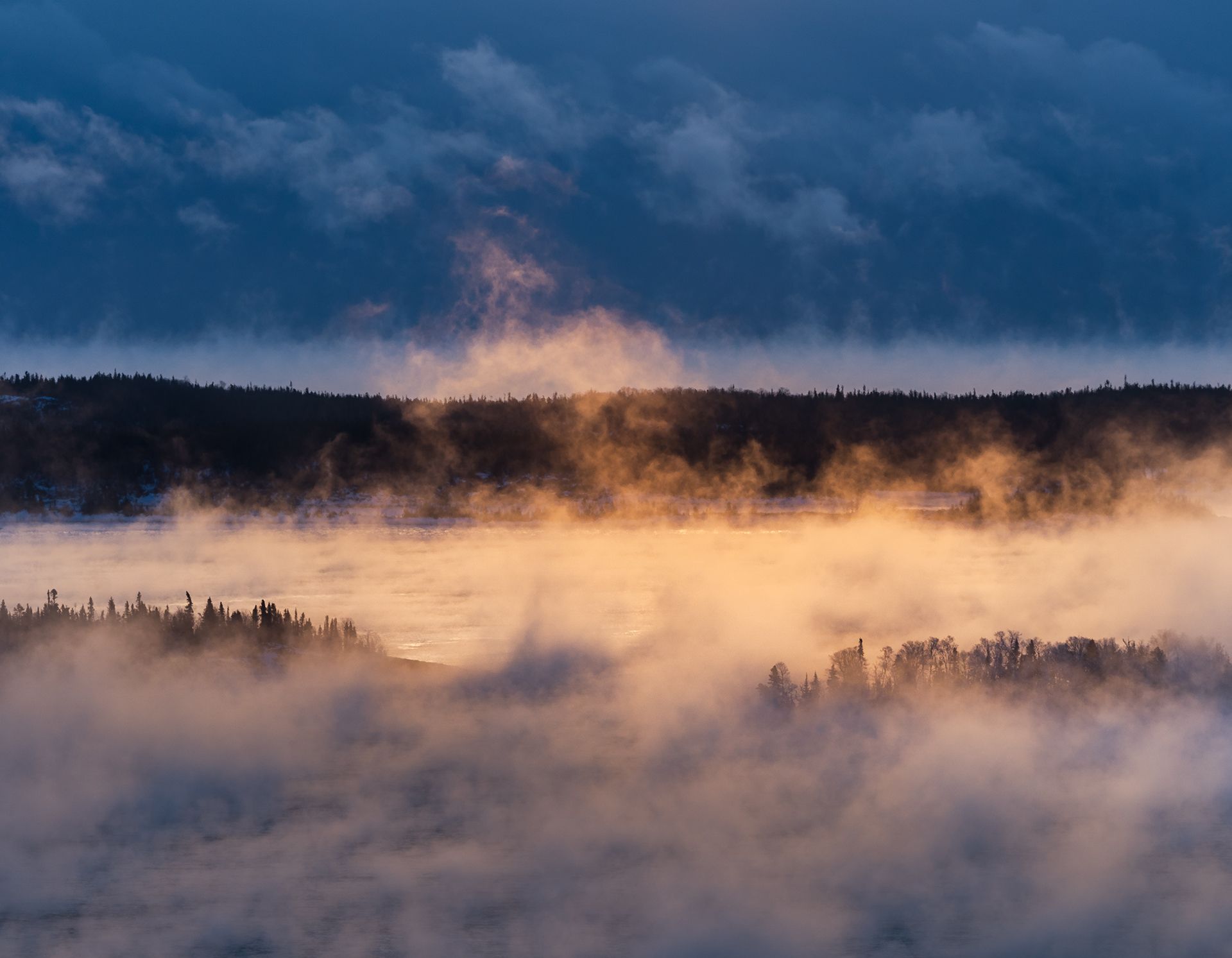 Islands of Lake Superior admist sea smoke at sunrise