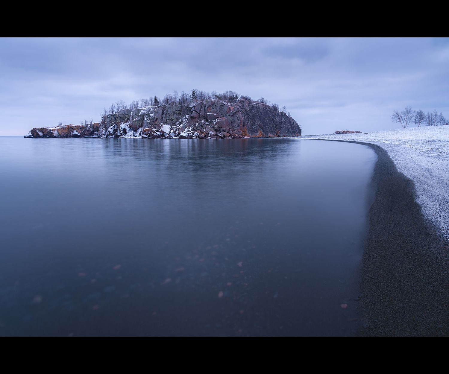 Black Beach on Lake Superior on a dark winter morning