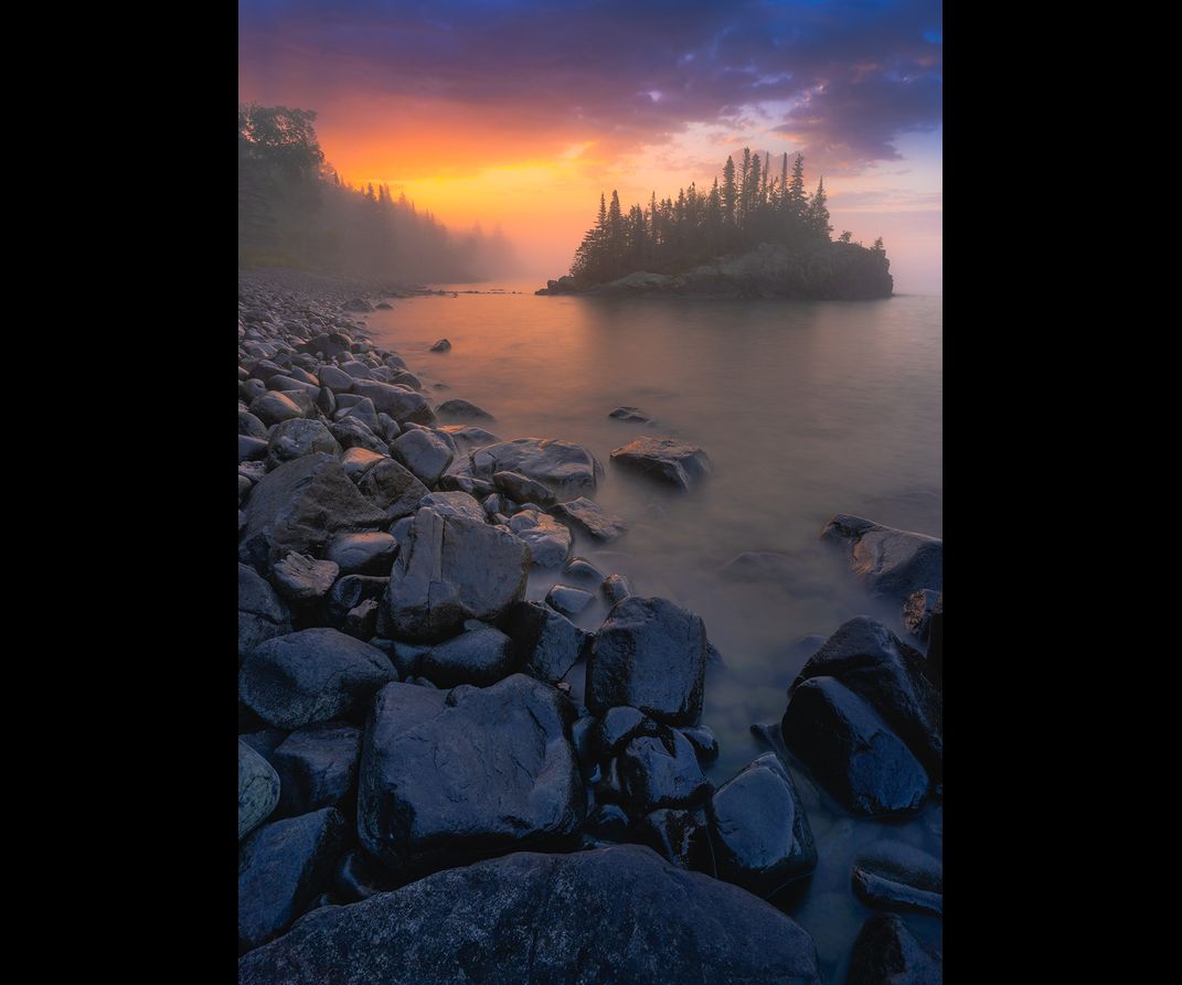 A foggy island at sunrise off the coast of Lake Superior