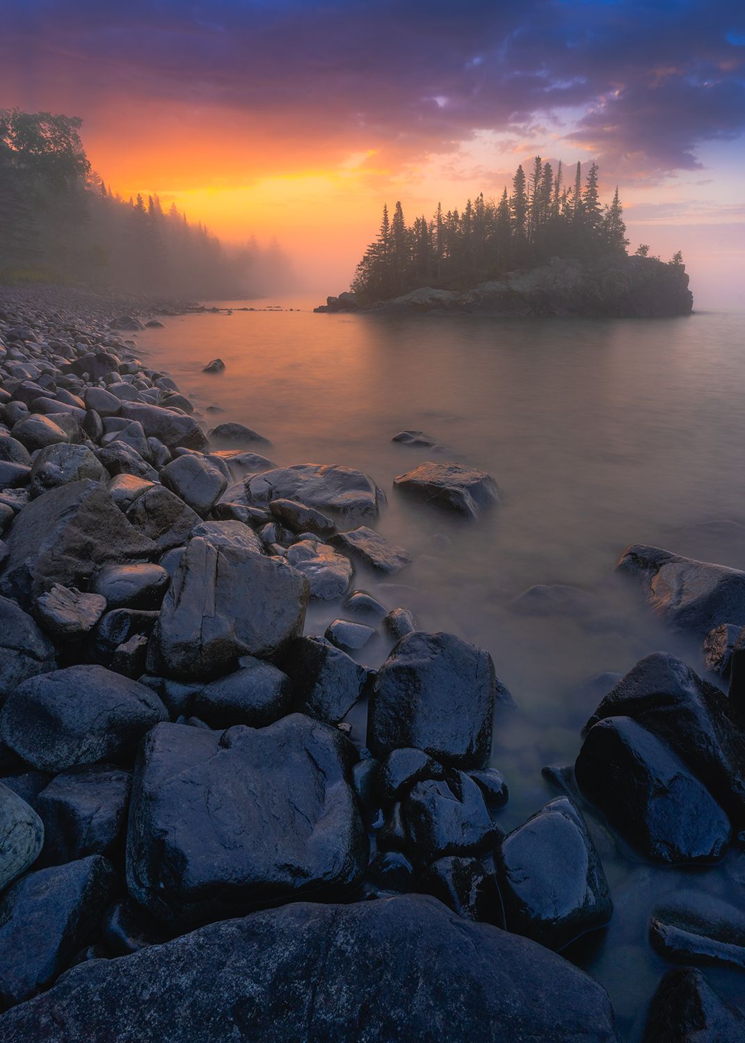 A foggy island at sunrise off the coast of Lake Superior