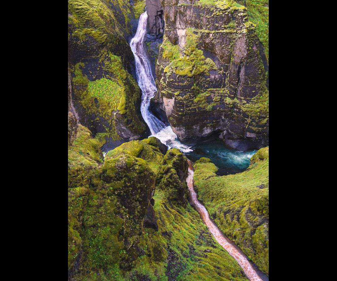 Looking down on a canyon in Iceland where two waterfalls connect