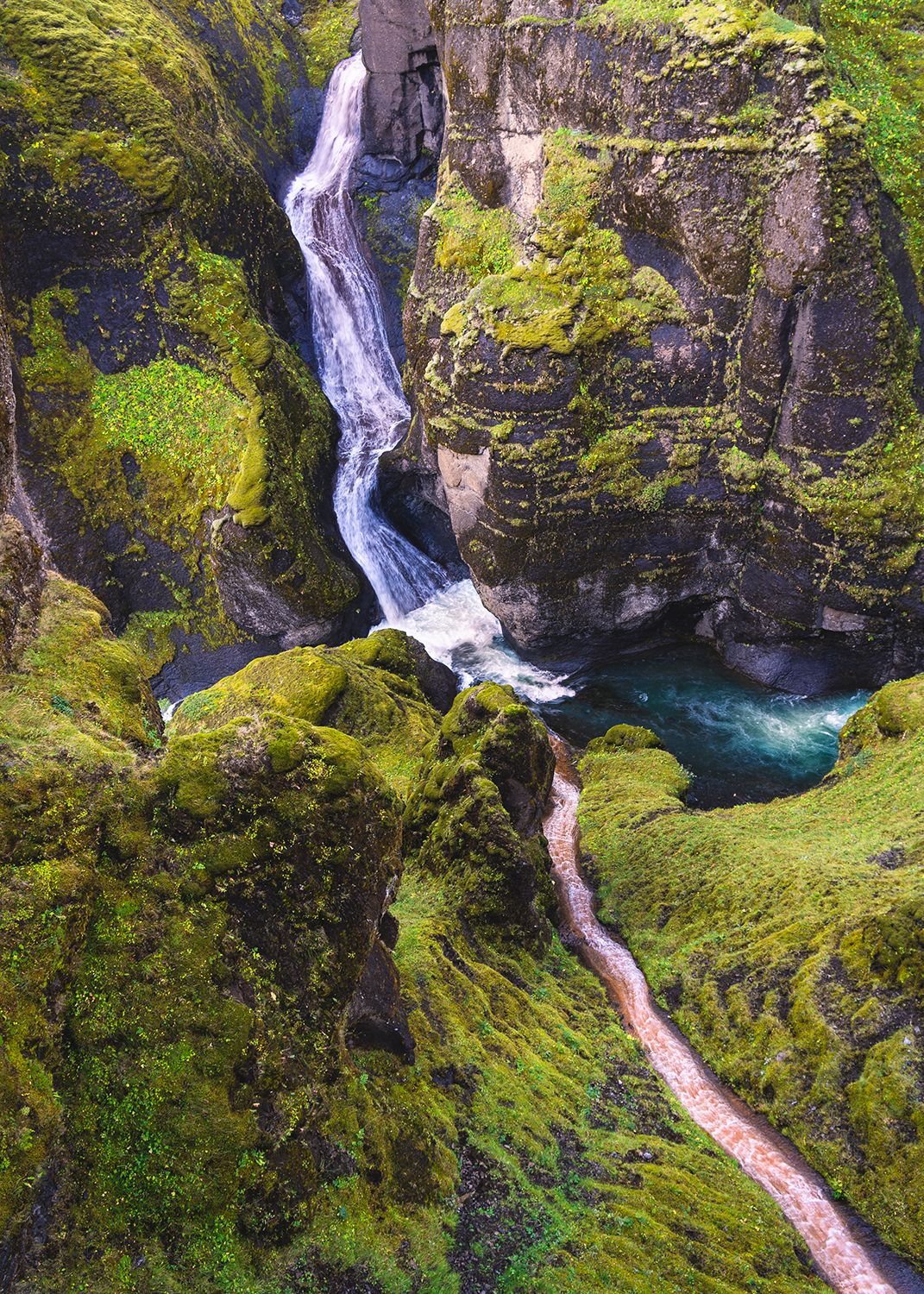 Looking down on a canyon in Iceland where two waterfalls connect